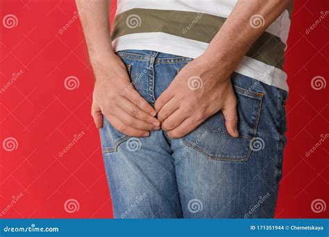 Man Suffering From Hemorrhoid On Red Background Stock Photo Image Of Medication Hygiene