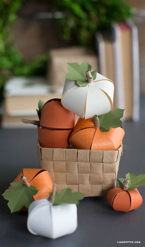 Paper Pumpkins And Gourds In A Basket On A Table