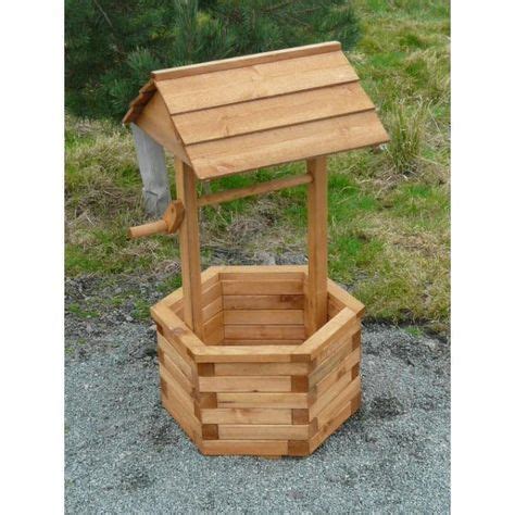 Consider using a barrel or box as the base. Wishing well medium | Wood planters, Wishing well plans ...