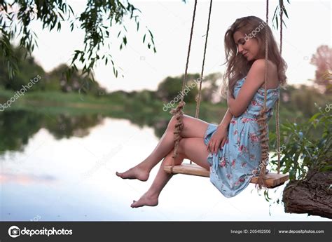 Sexy Woman Swinging On The Swing Outdoor Hair Free Legs Stock Photo By