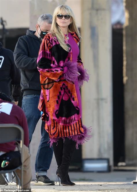 heidi klum flaunts her sense of style in a colorful coat on the set of germany s next top model