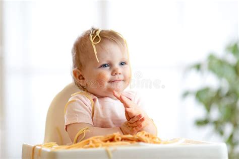 Adorable Little Baby One Year Eating Pasta Indoor Funny Toddler Child