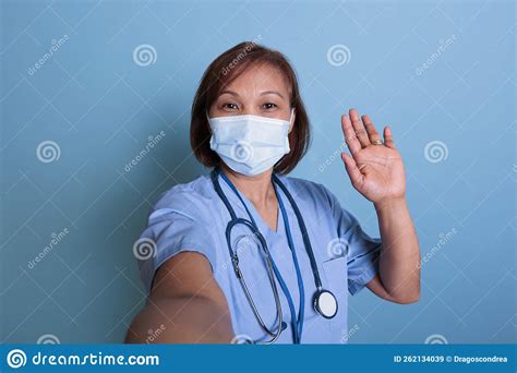 Senior Nurse Greeting Remote Doctor during Online Videocall Meeting