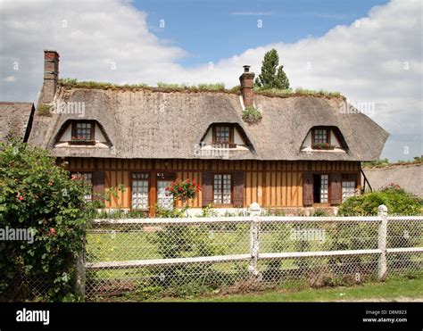 Traditional Normandy Thatched Cottage And Garden Stock Photo Alamy