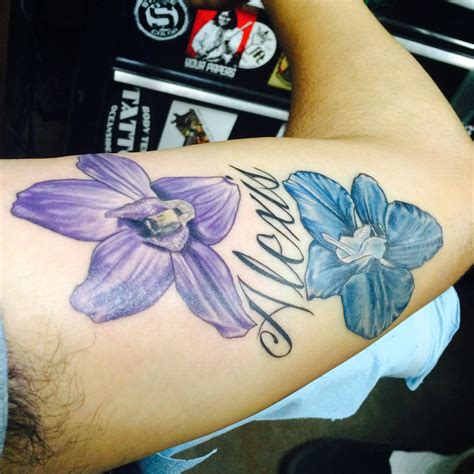 My Husbands Beautiful Tattoo July S Birth Flower Is Larkspur Each Color Variation Of Larkspur