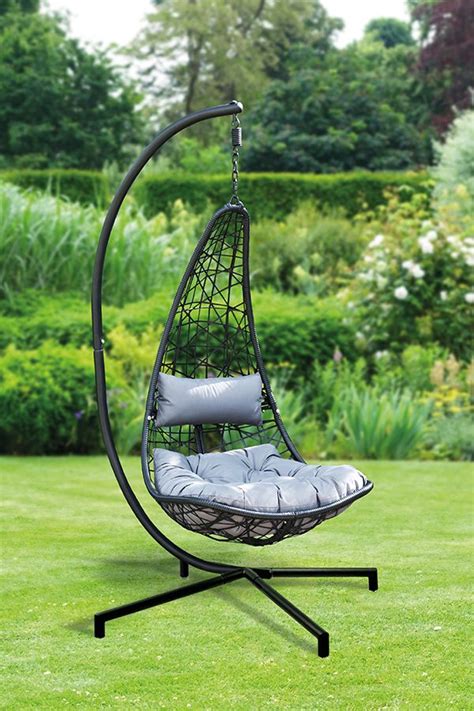 A Hanging Chair In The Middle Of A Lawn