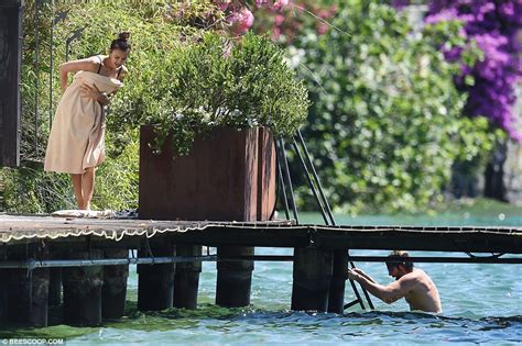 Irina Shayk Wears Black Bikini As She Enjoys Lake Swim With Shirtless