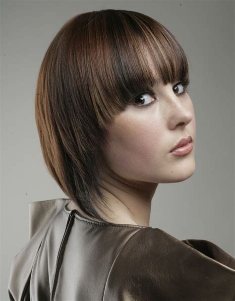 Wanna change your hair game this season? Medium length hairstyle with angled sides and hair that ...