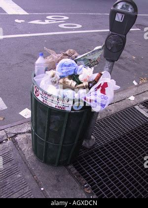 Overflowing Trash Can On The Street In New York City USA Stock Photo