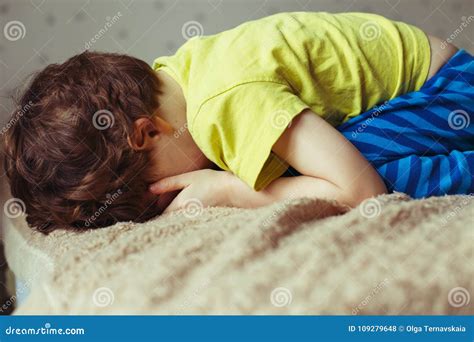 Tired Toddler Boy Lying On The Bed With His Face Down Crying Little