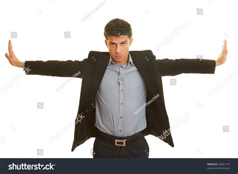 Business Man Stretching His Arms To The Side Stock Photo 34361170