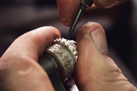 Sent from potato using gagt. Close up of the hands of a goldsmith while he is making a ...