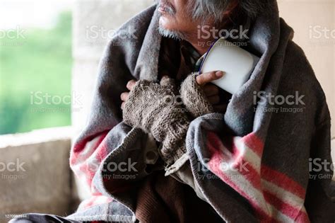 Poor Old Homeless Asian Man Sitting With Dirty Blanket Gloves Sitting