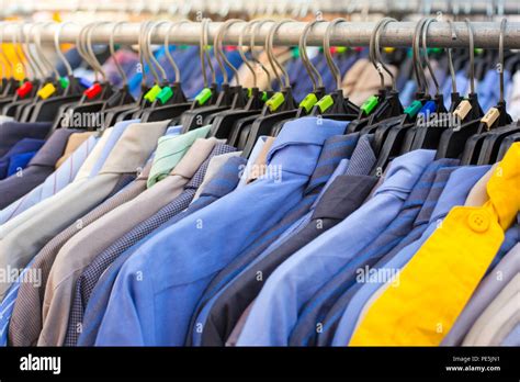 Many Shirts Hanging On A Rack In Cloth Shop Stock Photo Alamy