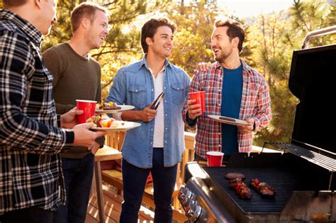 Group Of Male Friends Enjoying Barbeque Together Footprints Resort