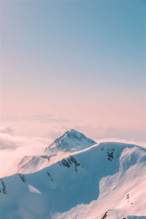 Snow Covered Mountain Under Cloudy Sky During Daytime Photo Worthpin