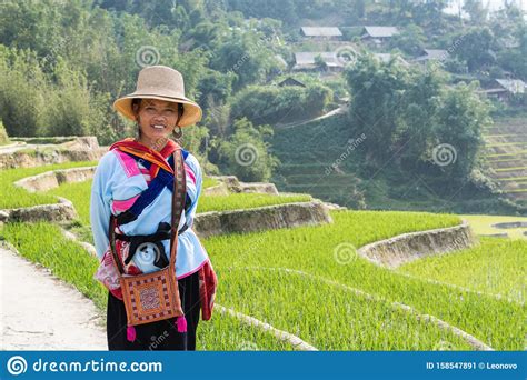 Sapa, Vietnam - May 2019: Hmong Woman In Traditional Dress Walks Along ...