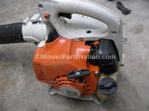 Remove the top on the gas tank and position a plastic container to the side of the mower on the ground. Replaces Stihl BG 55 Blower Carburetor - Mower Parts Land