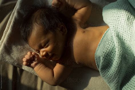 Newborn In Golden Light By Stocksy Contributor Diane Durongpisitkul