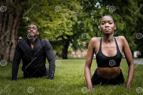 Black Brother And Sister Twins Doing Exercise Outdoors In Stylish
