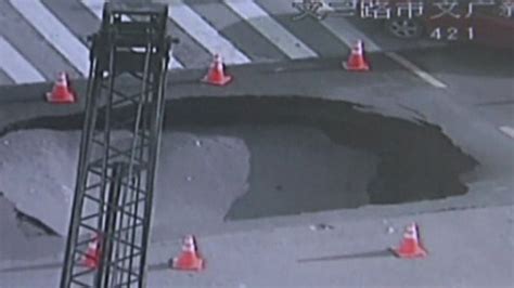 Huge Sinkhole Swallows Street In Fukuoka Japan Bbc News