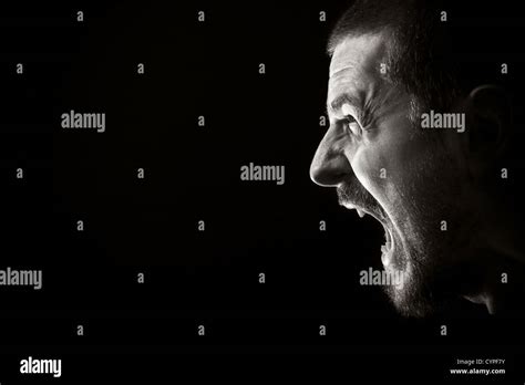 Portrait Of Screaming Angry Man On Black Background Stock Photo Alamy