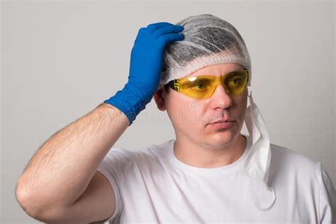 Doctor In A Surgical Mask Gloves And Glasses Surgeon Before The