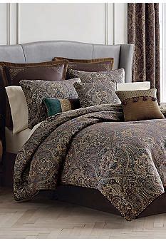 The Comforter Is Made Up With Many Different Colors And Patterns