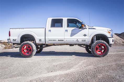 Ninapretty White Lifted Truck With Red Rims