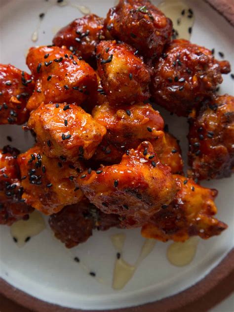 The korean spicy chicken is bathed in a spicy, savory marinade spiked with soy sauce, honey, rice wine, garlic, ginger, and kicking gochujang. Korean Chicken Nuggets | Spoon Fork Bacon