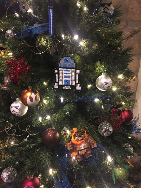 A star wars fan will enjoy admiring it through the whole holiday. #StarWars Christmas tree ornaments | Star wars christmas tree, Christmas tree ornaments, Star ...