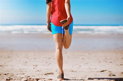Woman Runner Stretching And Beach For Fitness Exercise Or Wellness