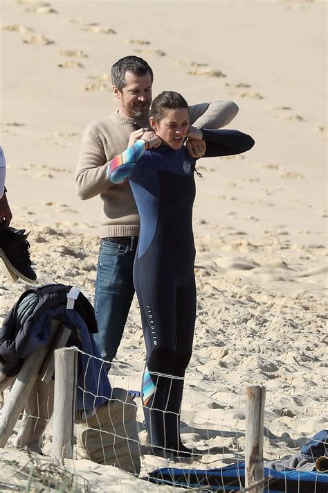 Marion Cotillard Gets Help From Husband Guillaume Canet To Put On A Wetsuit As She Hits The Wave
