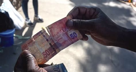 Buying Banknotes To Survive Zimbabwes Sky High Inflation
