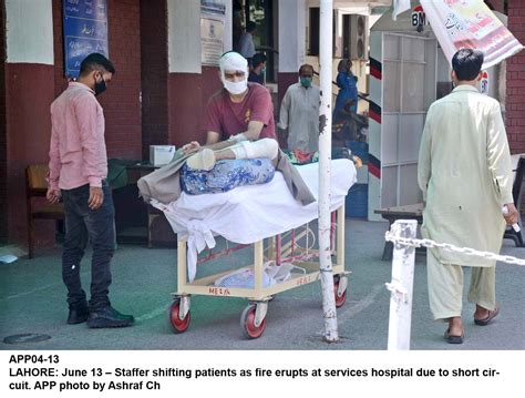 Lahore June 13 Staffer Shifting Patients As Fire Erupts At Services