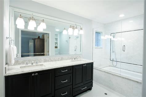 Traditional Master Bathroom With Dark Cabinets And White Quartz