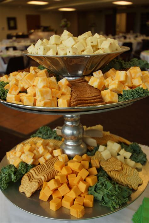 Tiered Stand To Display Assorted Cheese Cubes And Crackers For A Summer