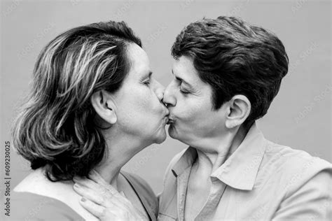 Senior Gay Lesbian Couple Kissing Outside Lgbtq Aged Tourists Having Tender Moment Black And