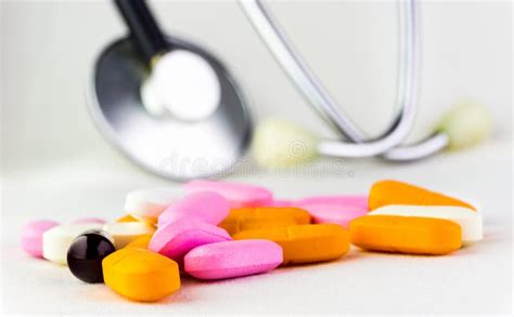 Medical And Health Concept With Medicine Pills Tablets Blurred