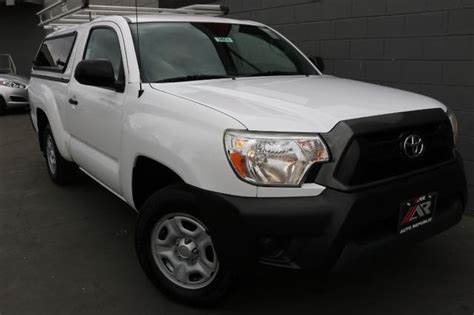 Pre Owned 2014 Toyota Tacoma 2wd Reg Cab Truck In Orange 24934 Auto