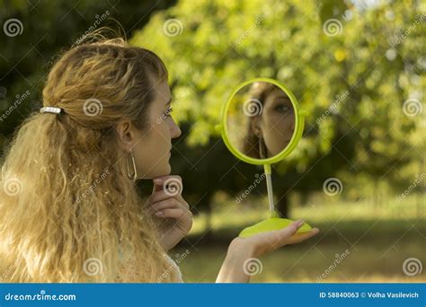 Young Beautiful Girl Look Into Mirror In The Parksoft And Blur Conception Stock Image Image
