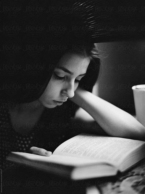 Concentrated Woman Reading Book Del Colaborador De Stocksy Alexandr