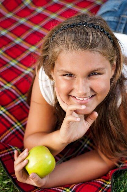 Premium Photo Portrait Of Little Girl With Green Apple Outdoor