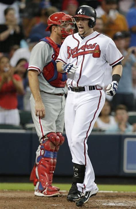 atlanta braves chris johnson crosses home plate after hitting a two run home run in the third