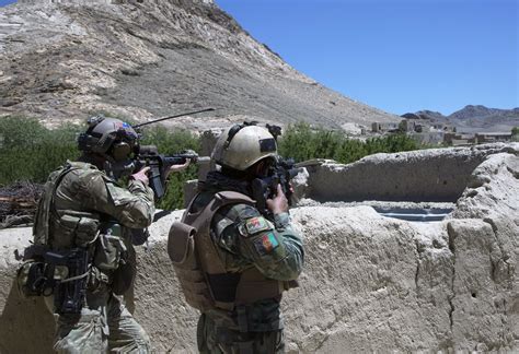 Us Army Green Beret And Afghan Commando During An Operation To Find