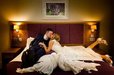 A Newly Married Couple Kissing In Their Bedroom Suite Wedding Night Blue Wedding Lucky Blue