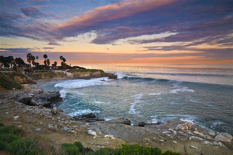Another secluded spot to watch the sunrise is along schooner head road to the schooner head overlook. "Sunrise, La Jolla Cove" by Robert Whiteman | Redbubble