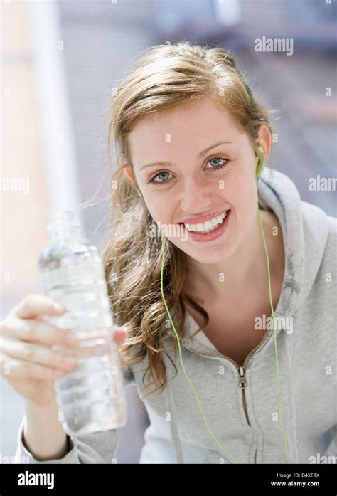 Young Woman Drinking Water After Workout Stock Photo Alamy