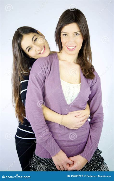 Two Happy Girlfriends Hugged Smiling Stock Photo Image Of Sisters