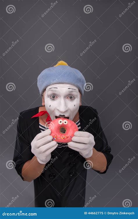 Portrait Of Handsome Male Mime Eating A Tasty Pink Stock Image Image